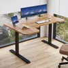 A modern adjustable height desk with dual monitors and a tablet, positioned next to a large window with blinds. Anteprima dell’immagine prodotto