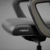 A close-up shot of a black office chair with a logo and text on the seat. Náhled obrázku produktu