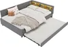 A grey upholstered corner daybed with a pull-out trundle bed extended. It has pillows and a blanket on the main bed, and a shelf with built-in LED lighting above the headboard. Anteprima dell’immagine prodotto
