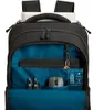 The inside of an open black backpack with various items organized within its compartments. Produktbild-Vorschau