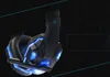 A black gaming headset with blue LED accents is displayed against a textured black background with blue diagonal lines. Produktbild-Vorschau