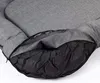 A close-up view of a gray dog bed with a zipper partially open, revealing the black inner lining. Produktbild-Vorschau