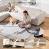 A woman is using a steam cleaner on a rug in a living room, with a child and a dog nearby. Smaller inset images show the cleaner being used on a stovetop and upholstery. Anteprima dell’immagine prodotto