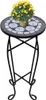 A mosaic side table with a potted yellow flower on top, presented against a white background. Produktbild-Vorschau