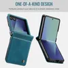 Two flip phones in teal leather cases, one open and one closed, against a light gray background. Produktbild-Vorschau