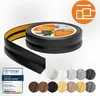 A roll of black flexible skirting board with adhesive backing, displayed with various color swatches and a quality seal. Produktbild-Vorschau