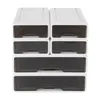 A stack of white plastic drawer organizers with transparent gray drawers. Podgląd zdjęcia produktu