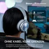 A person wearing a silver gaming headset, with a computer screen in the background. Produktbild-Vorschau