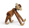 A wooden toy monkey on a white background. Anteprima dell’immagine prodotto