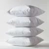 A stack of four white pillows against a white background. Produktbild-Vorschau