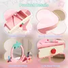 A collage of four close-up images showcasing the features of a pink children's play vanity set. Produktbild-Vorschau