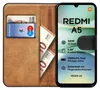A brown flip case for a smartphone, with a phone inside displaying product specifications. There are also euro banknotes and a bank card visible in the case's slots. Náhľad obrázku produktu