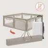 A playpen is shown folded into a carrying bag next to a suitcase, with an icon indicating no tools are needed for assembly. Produktbild-Vorschau