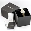 An Emporio Armani watch is presented in its original packaging, alongside its authenticity certificate and warranty booklet. Produktbild-Vorschau
