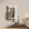 A bathroom setting with a towel warmer and a bathtub. Produktbild-Vorschau