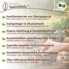 A marketing image with text and logos, overlaid on a blurred background of plants and gardening tools. Produktbild-Vorschau