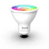 A white smart LED light bulb with a colorful light display at the top, set against a white background. Produktbild-Vorschau