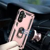 A person's hand is holding a rose gold phone case with a ring holder, which is magnetically attached to a car vent mount. Produktbild-Vorschau