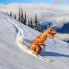 A person in a T-Rex costume skiing down a snowy mountain. Produktbild-Vorschau