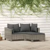 A grey rattan garden lounge set with dark grey cushions is placed on a wooden deck, with green ivy growing on a white wooden wall in the background. Podgląd zdjęcia produktu