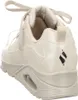 A close-up rear view of a beige Skechers sneaker. Voir les images du produit