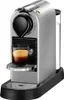 A silver Nespresso coffee machine with a cup of espresso. Podgląd zdjęcia produktu