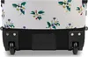 A close-up view of the bottom of a rolling suitcase with a floral pattern. Voir les images du produit