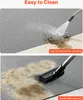 Two images showing how to clean a garage floor mat. The top image shows water being sprayed onto a dirty mat, and the bottom image shows a vacuum cleaner cleaning the mat. Anteprima dell’immagine prodotto