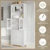 A white bathroom cabinet with glass and solid doors, displaying various toiletries and folded towels, with feature callouts on the right side. Náhled obrázku produktu