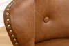 Close-up of a brown leather chair showing details of the upholstery and studs. Produktbild-Vorschau