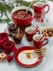 A festive holiday table setting with a punch bowl, drinks, plates, and cutlery. Produktbild-Vorschau