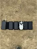 A solar charger with multiple panels is laid out on the ground, charging a small drone. Produktbild-Vorschau