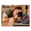 A man is sleeping on a couch next to a vibrating alarm clock. Náhľad obrázku produktu