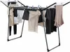 A drying rack with clothes hanging on it. Produktbild-Vorschau