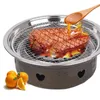 A grill with steak being cooked and sauce being poured on it, with oranges in the foreground. Produktbild-Vorschau