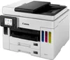 A white Canon MAXIFY GX 7050 Multifunktionsdrucker is shown from a three-quarter front angle against a white background. Produktbild-Vorschau