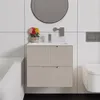 A modern bathroom vanity with a sink, faucet, and drawers, next to a bathtub and toilet. Anteprima dell’immagine prodotto
