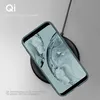 A smartphone case is shown being placed on a wireless charger. Produktbild-Vorschau