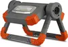 A portable LED work light with a gray and orange design, shown from a low angle on a white background. Produktbild-Vorschau