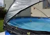 An outdoor swimming pool covered by a transparent dome-like structure, with leaves scattered on the cover and in the water. Anteprima dell’immagine prodotto