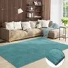 A living room scene with a sectional sofa, rug, and shelves. Produktbild-Vorschau