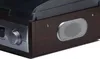 A close-up view of a retro turntable's side panel, showing a speaker and a control knob. Produktbild-Vorschau