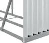Close-up view of the bottom section of a metal firewood rack, showing its construction and corrugated metal siding. Náhled obrázku produktu