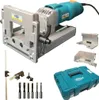 A collection of woodworking tools, including a dowel drilling machine, bits, and accessories, laid out on a white background. Produktbild-Vorschau