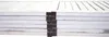 A close-up view of a white wooden room divider with visible hinges. Produktbild-Vorschau