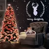 A Christmas tree and a chair with a kitten in a Santa hat. Produktbild-Vorschau