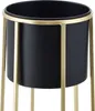 A close-up shot of a black planter with a gold stand. Produktbild-Vorschau