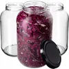 Three empty glass jars and one jar filled with chopped red cabbage, with a black lid in the foreground. Podgląd zdjęcia produktu
