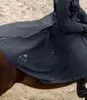 A person riding a horse, wearing a dark blue riding coat. Produktbild-Vorschau