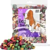 A bag of dog treats with a pile of treats in front of it. Produktbild-Vorschau